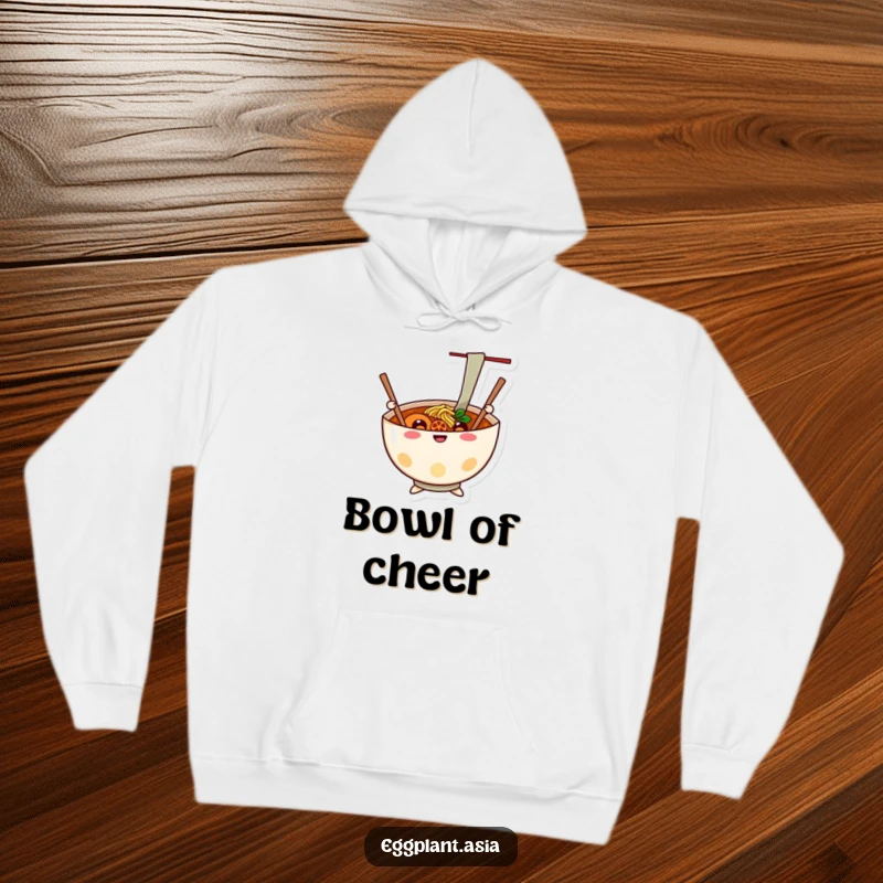 Funny cheerful ramen bowl character with chopsticks waving like arms, depicted on a cozy hoodie.